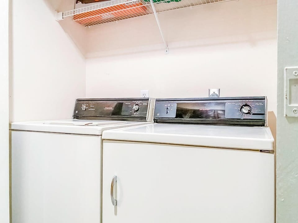 Laundry Room in condo with Washer and Dryer.