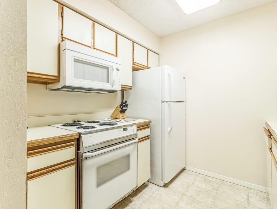 Kitchen equipped with full size Appliances.