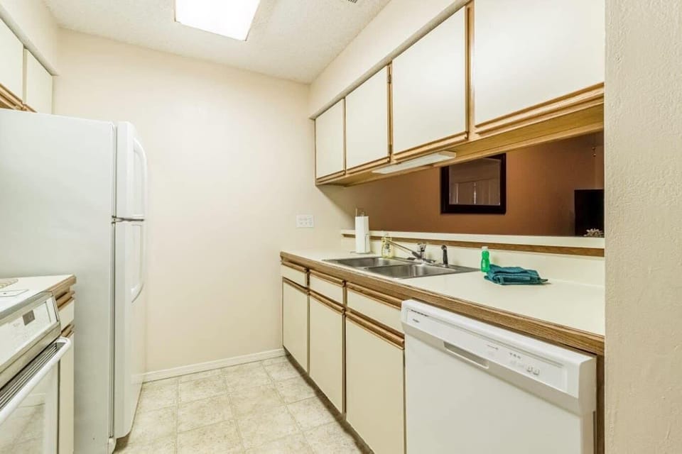 Kitchen overlooks Dining and Living Rooms.