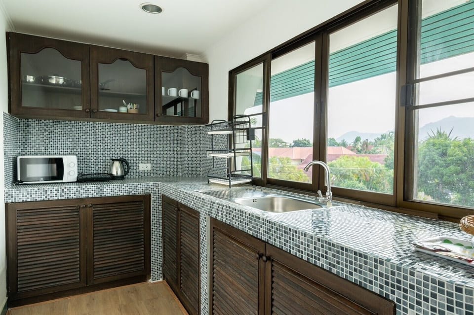 Two Bedroom Deluxe Suite With Garden View | Private kitchen | Fridge, electric kettle