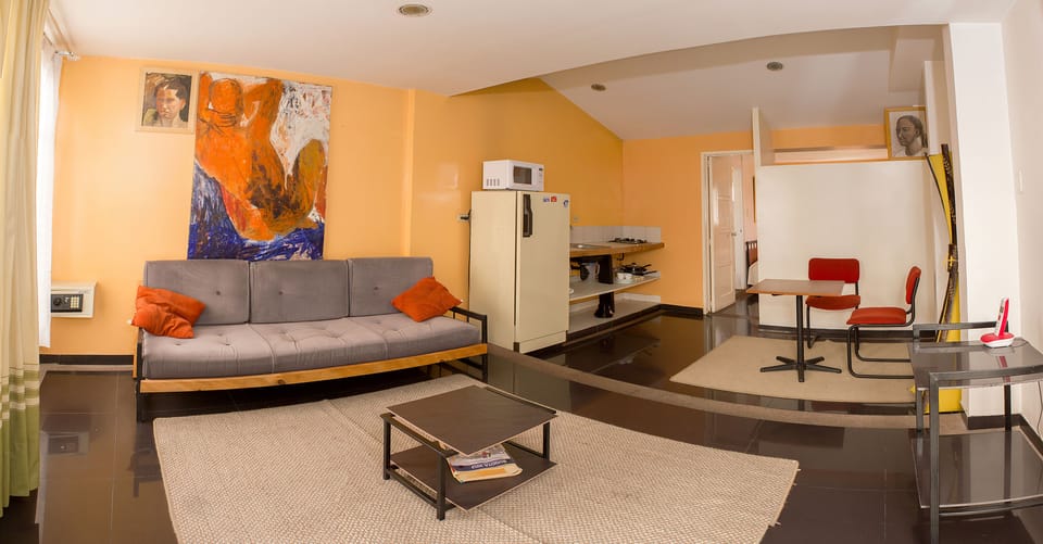Suite | Living area | 32-inch LCD TV with cable channels, TV