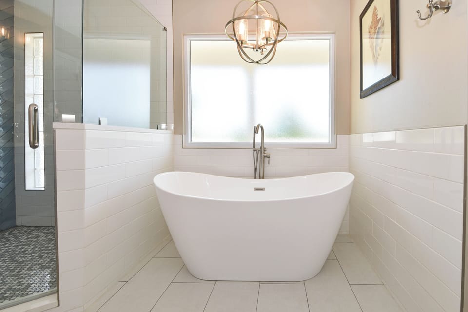 A Wave From It All - Primary Bathroom with Pedestal Tub