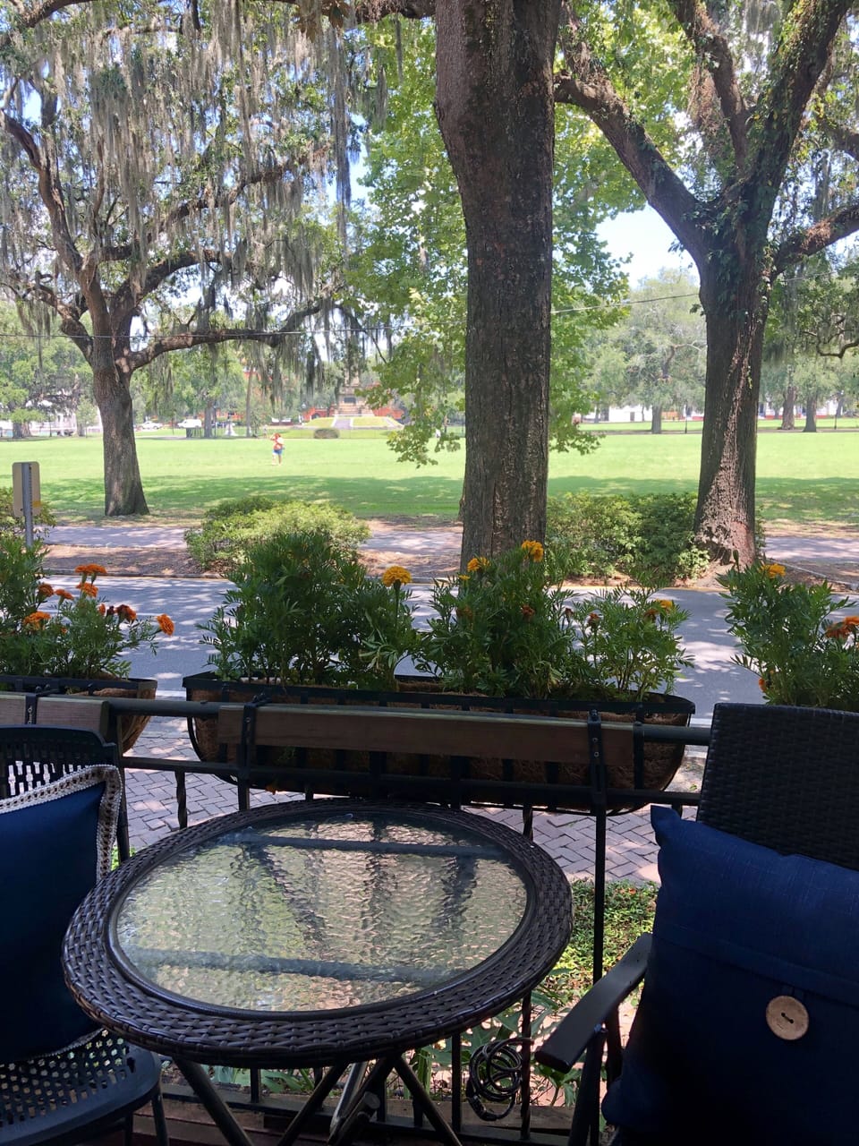 The unit has a balcony that overlooks Forsyth Park
