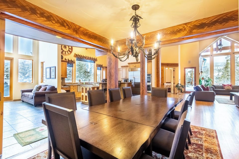 Gather around this stunning dining table where memorable meals await, perfectly positioned in your open-concept space with mountain views.
