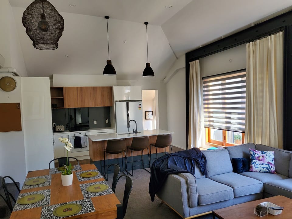 Signature Apartment | Living area | 32-inch TV with digital channels