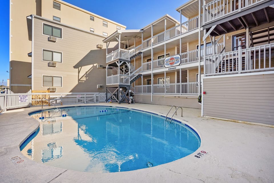 Outdoor pool below the balconies at Sun Villas A1, a 2-bedroom Crescent Beach condo rental