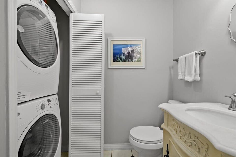 Downstairs half bath with laundry area