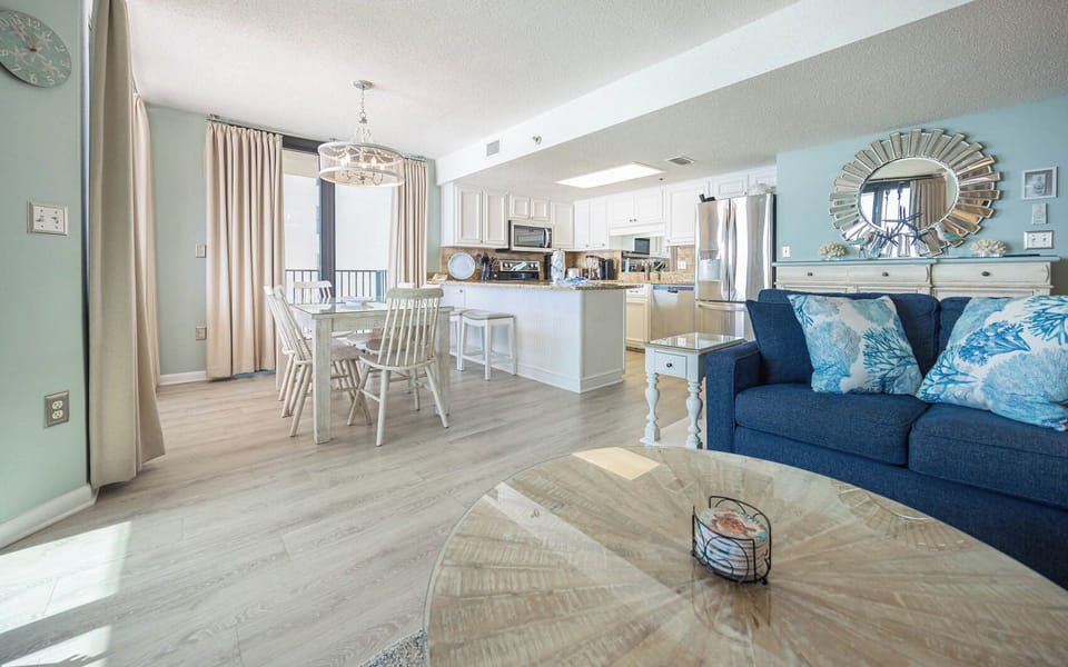 Dine at the charming table or relax on the cozy couch, enjoying the open layout and inviting decor throughout