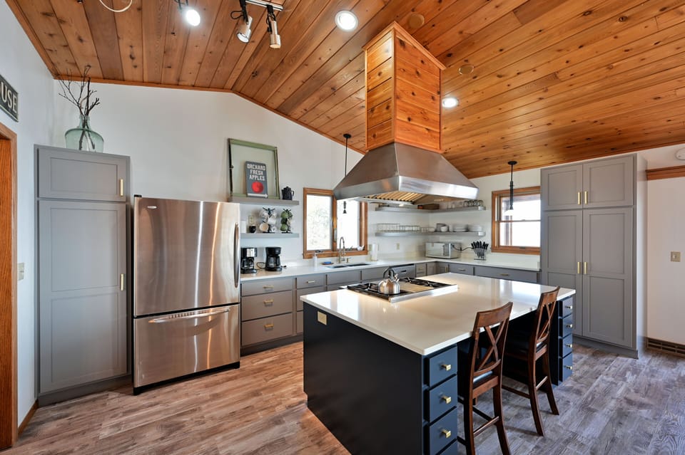 Completely renovated kitchen with Quartz countertops and Wolf Commercial Oven.