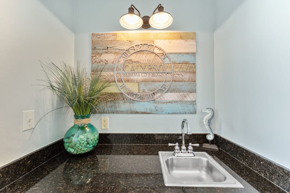 Your private kitchenette features granite counters and coastal charm, perfect for quick meals between beach adventures.