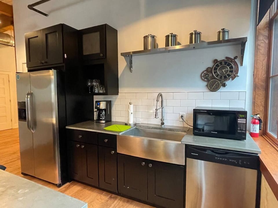 Cooks' Kitchen with appliances and stainless steel farmsink