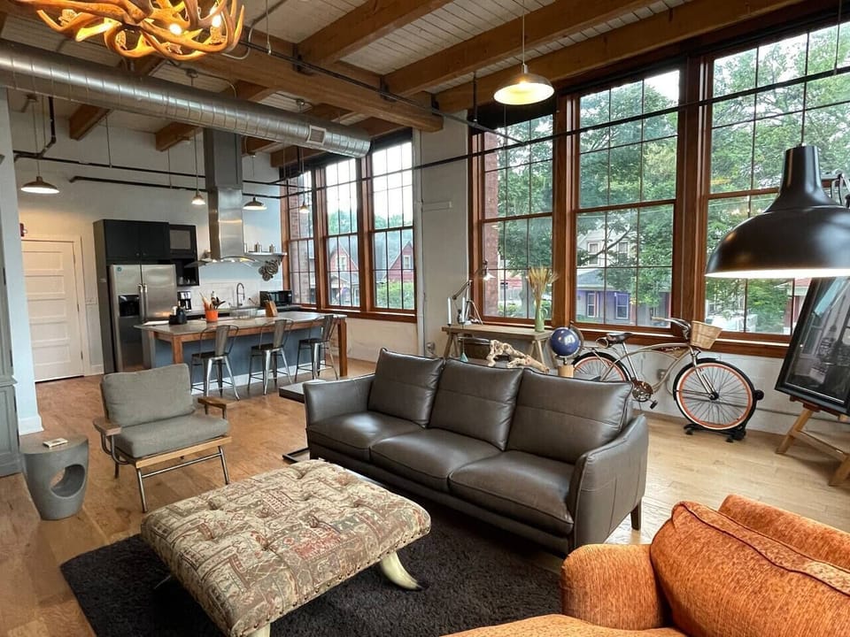 Living room looking towards kitchen bathed in light from the extra -large windows