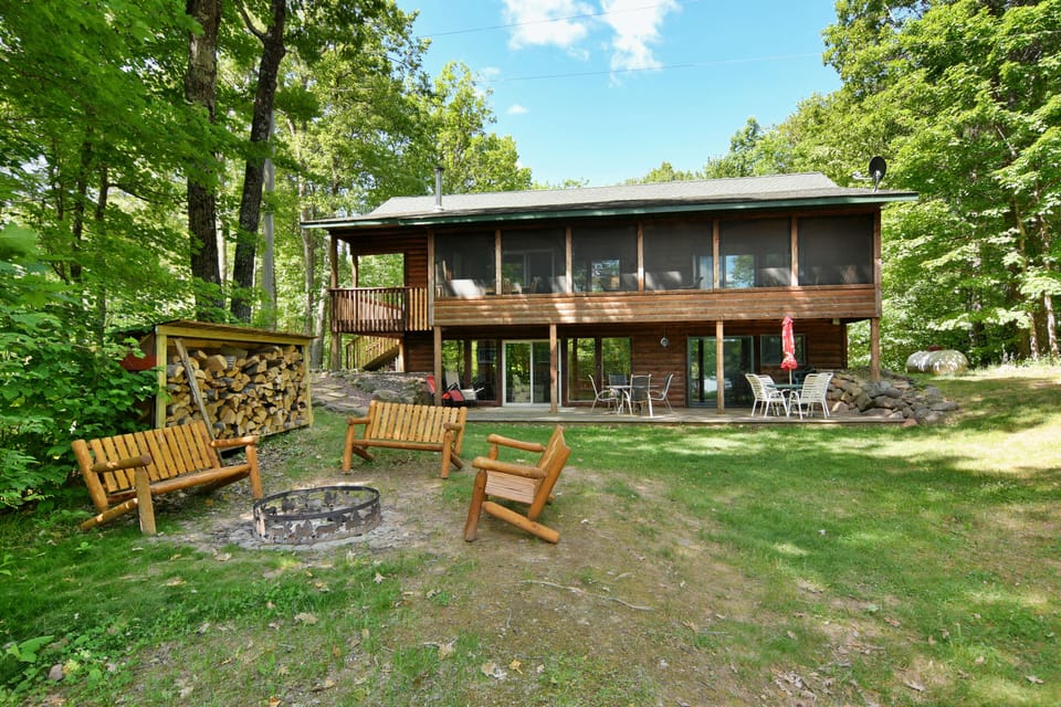 Back of the house view toward the lake with fire pit. 