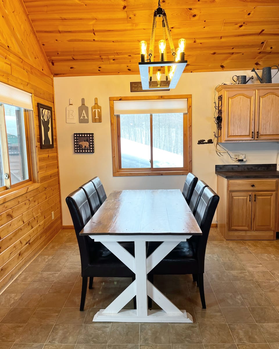 Large table with seating for 8 (2 extra chairs in master closet)