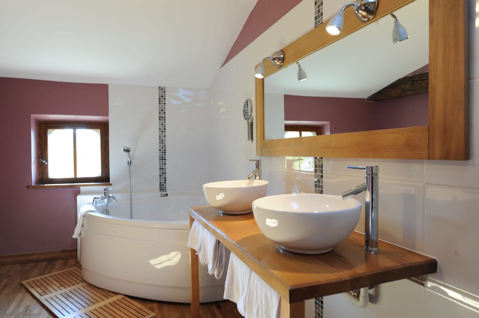 Family Suite, 2 Bedrooms | Bathroom | Rainfall showerhead, eco-friendly toiletries, hair dryer, towels