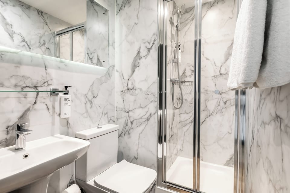 Shower, eco-friendly toiletries, hair dryer, towels