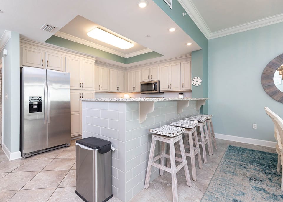 Gather with loved ones at the stylish breakfast bar, enjoying the open feel of the inviting kitchen