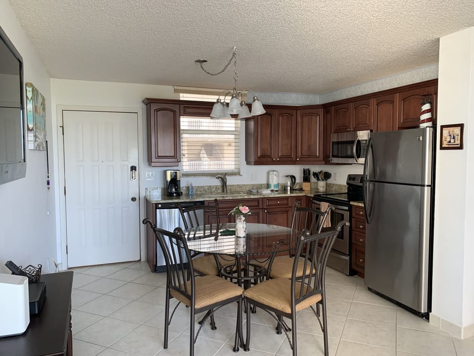 Recently updated kitchen with granite countertops, stainless steel appliances.
