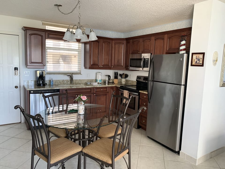 Recently updated kitchen with granite countertops, stainless steel appliances.