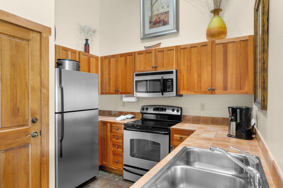 Full kitchen with stainless steel appliances