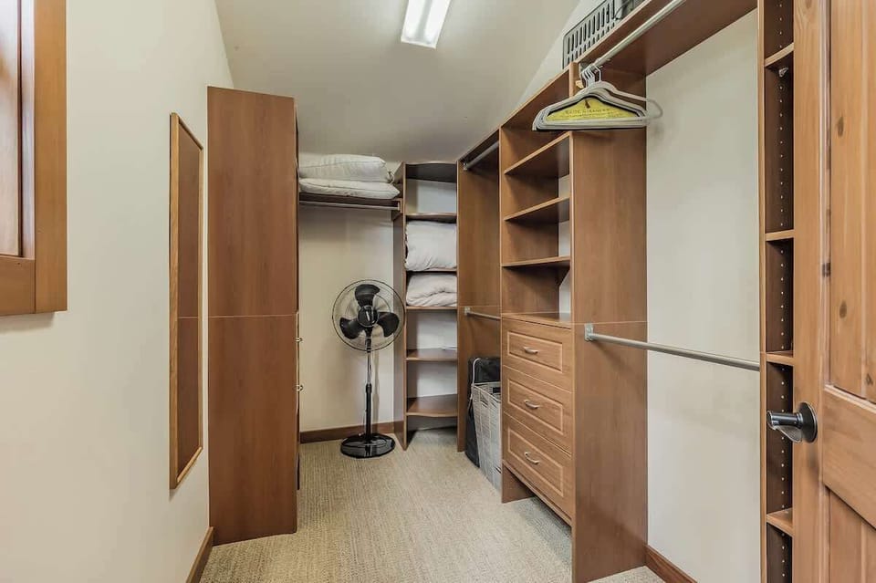 Walk in closet in the primary bedroom, also equipped with a pack n play