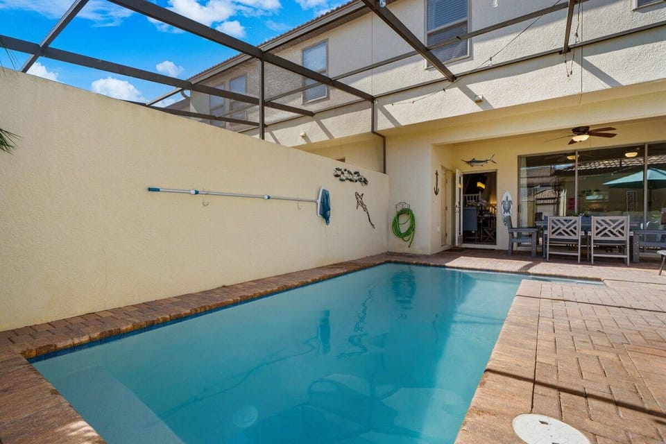 Enjoy the Outdoors Comfortably in Your Private Screened Pool Haven