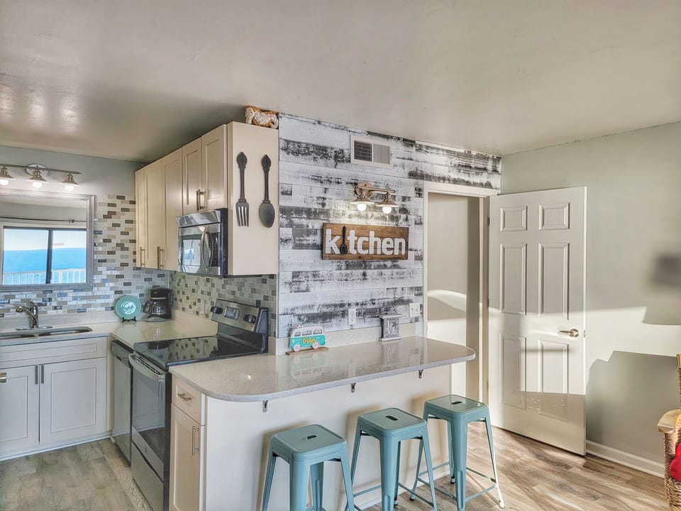 Fully renovated kitchen with new cabinets, appliances & granite countertops