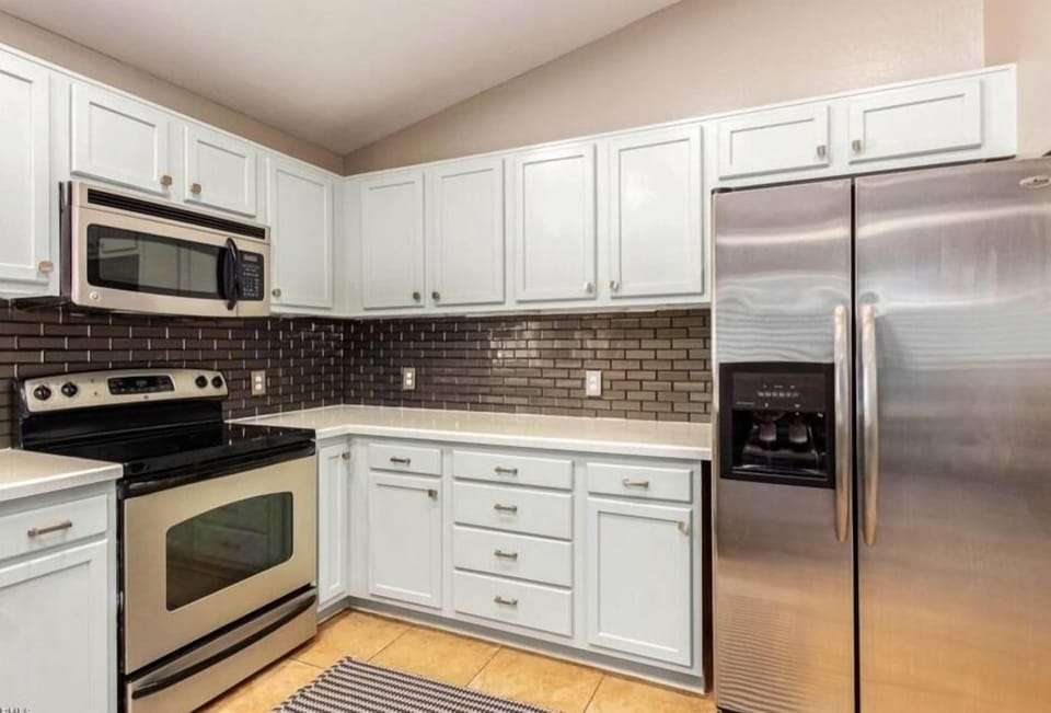 Large open kitchen w/ stainless steel appliances