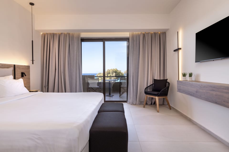 Double Room, Sea View | Minibar, blackout drapes, soundproofing, iron/ironing board