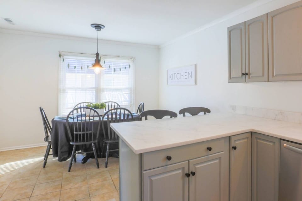 The dining table comfortably seats 6 people.  There are also 2 stools alongside the kitchen counter.
