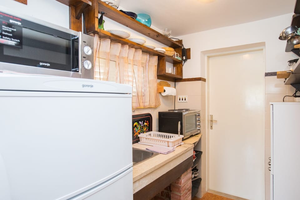 Studio (Studio Apartment with Private Beach a) | Private kitchenette | Fridge
