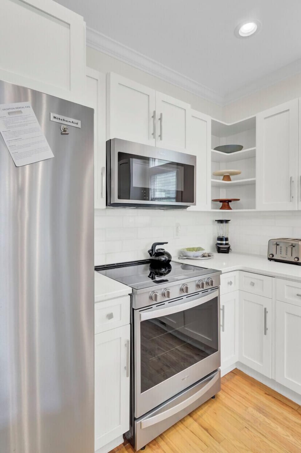 Step into your fully equipped kitchen with stainless steel appliances, crisp white cabinets, and everything you need to create memorable meals.