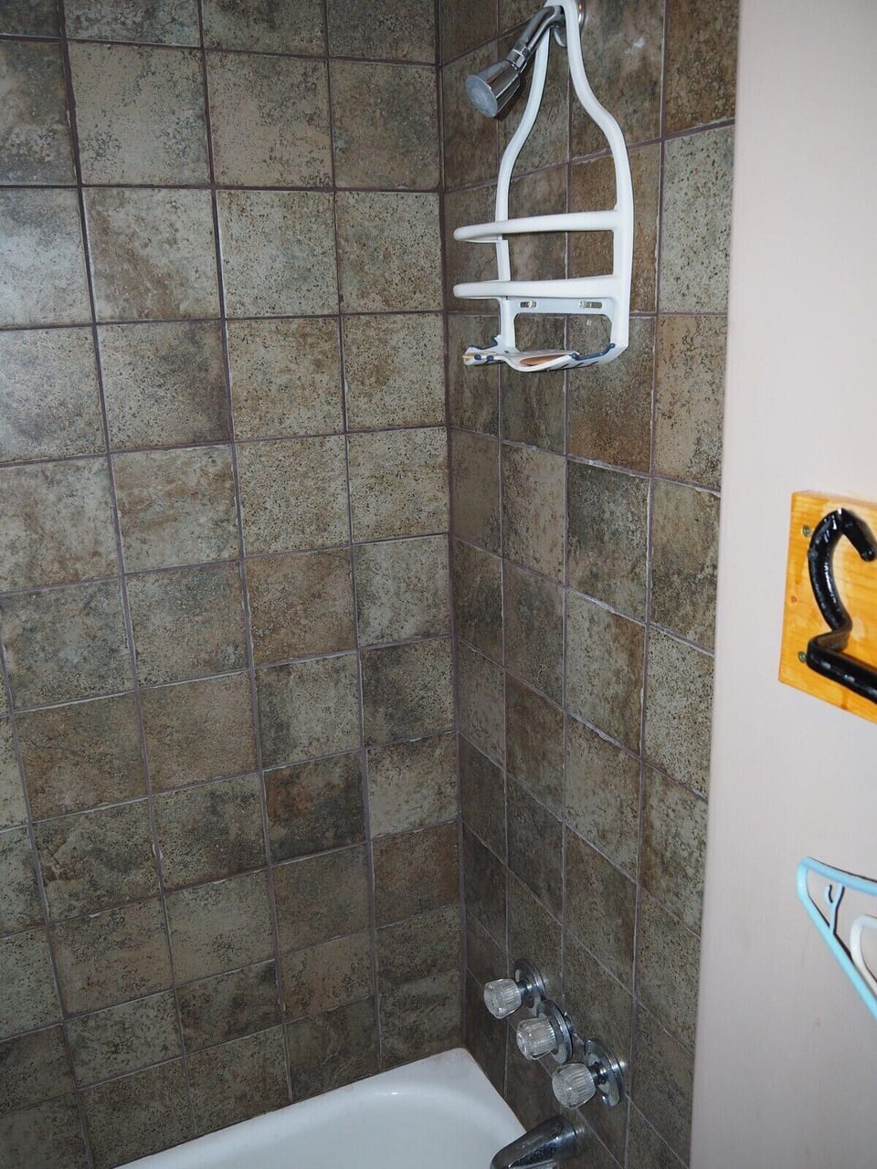 BATHROOM:  Includes combination tub / shower and toilet.  (Note that there is no vanity, sink, or mirror in the bathroom.)