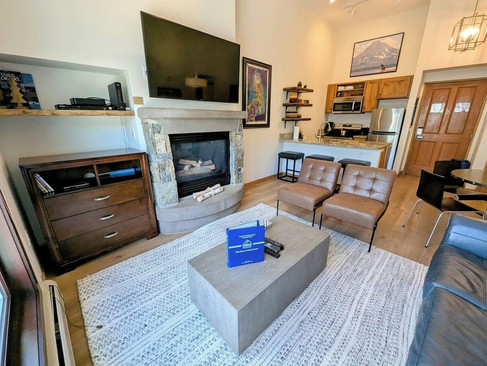 Relax by the gas fireplace on a snowy day in