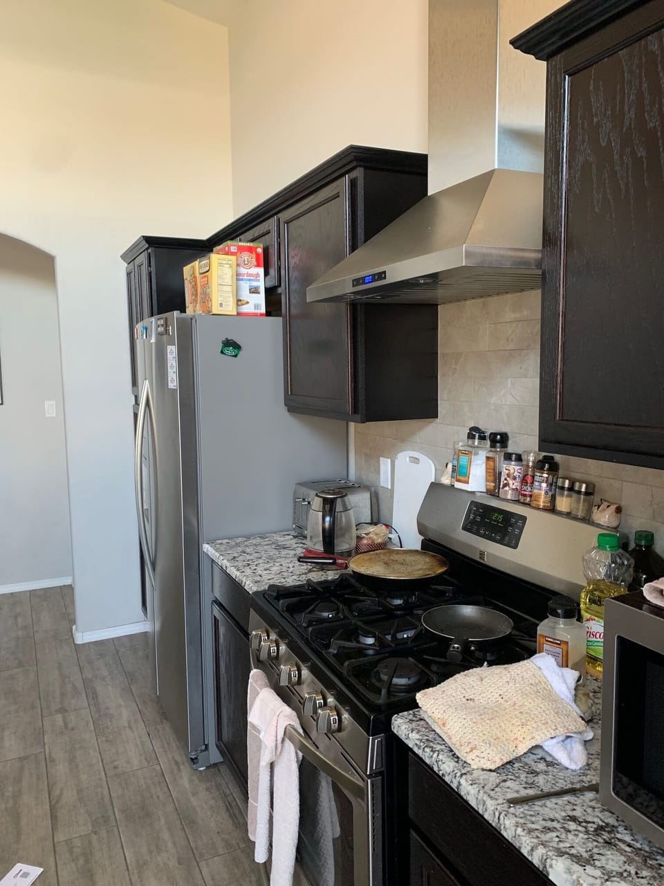 Hooded Stove and Side by side Refrigerator 