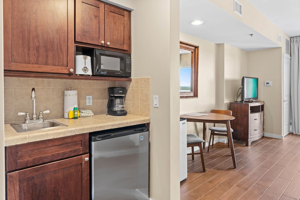 kitchen items - microwave, mini refrigerator, coffee pot
