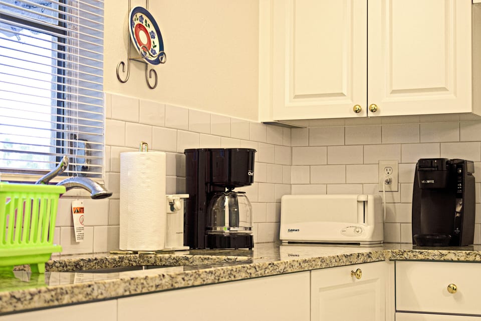 Kitchen counter with coffee makers and toaster