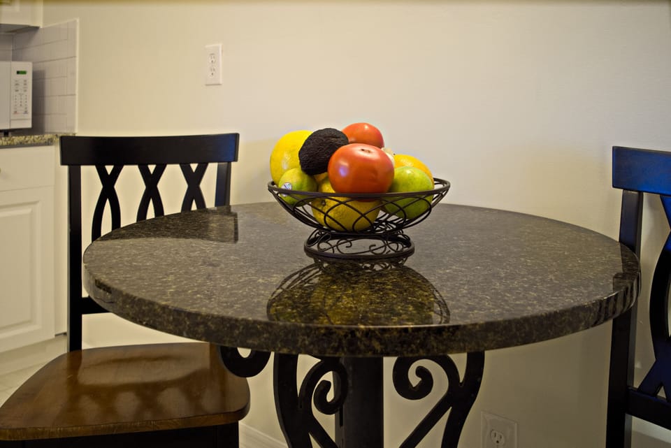 Kitchen eating area for two and local produce, in season