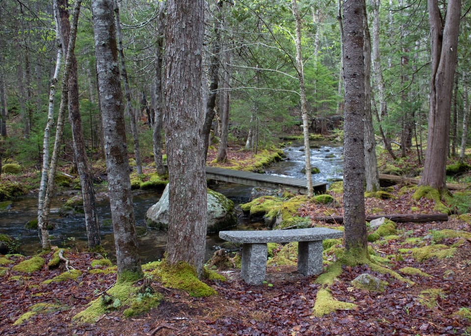 Granite bench by the stream