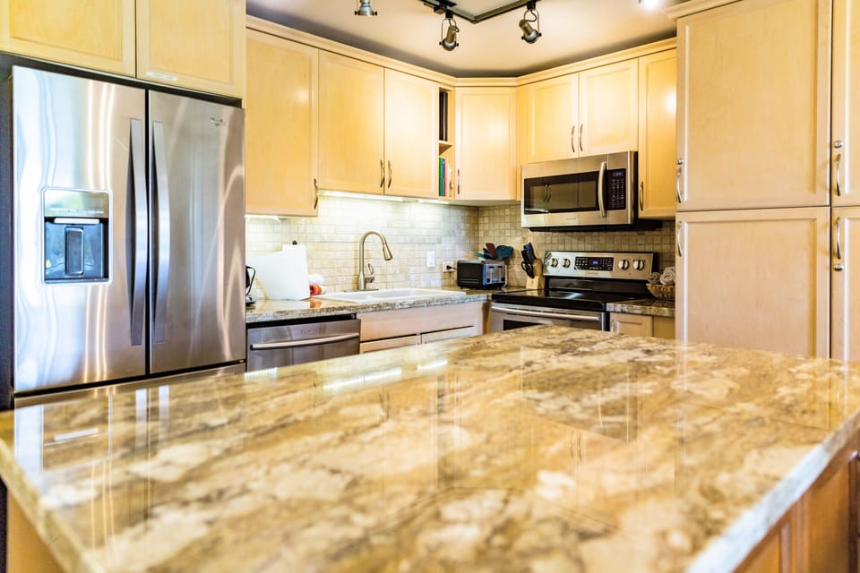 Feel right at home in this fully-equipped kitchen with granite countertops.
