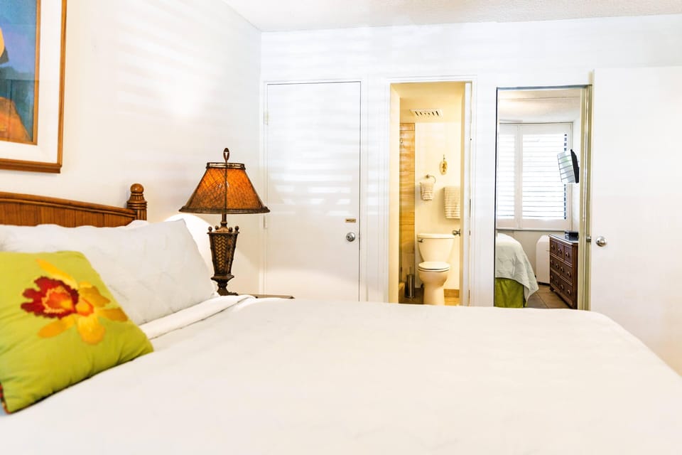 View of bedroom with attached master bathroom.