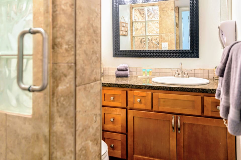 Hall bathroom with shower. Towels and starter soap/shampoo are provided.