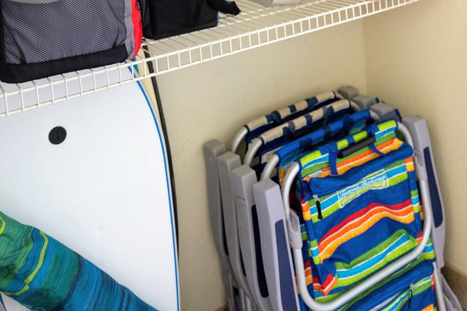 Beach gear (beach towels, chairs, coolers, boogie board, wagon) in hall closet