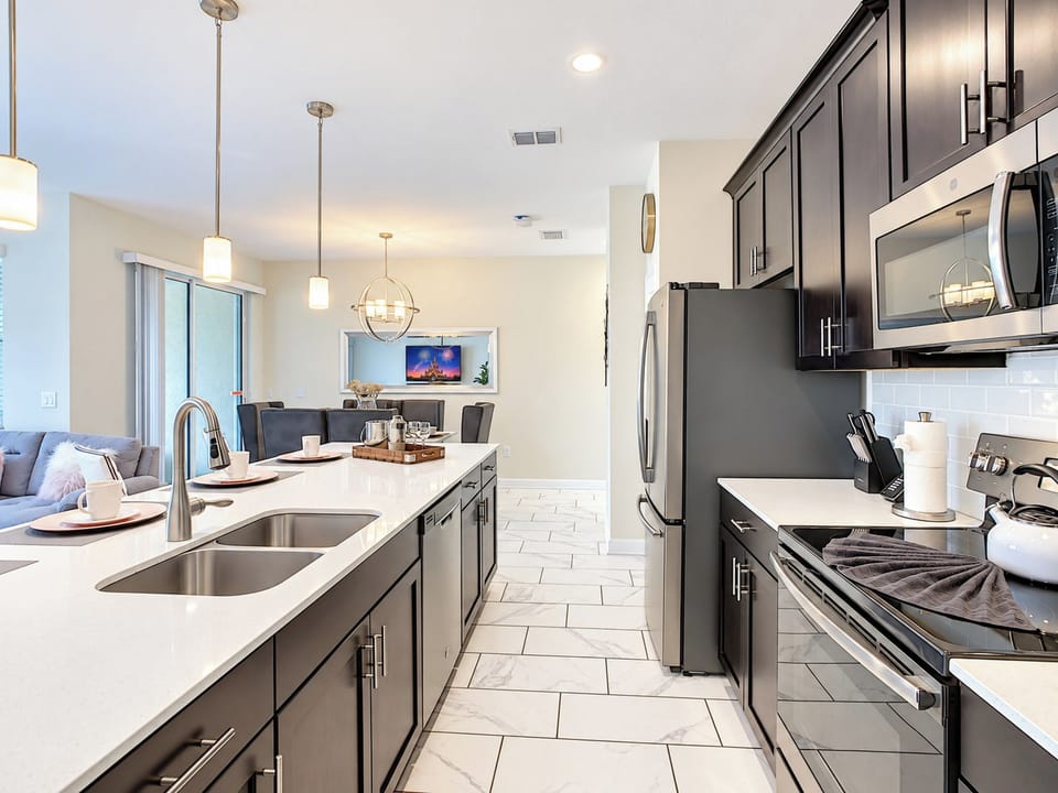 Open-Concept Kitchen with Island and Stainless Steel Appliances