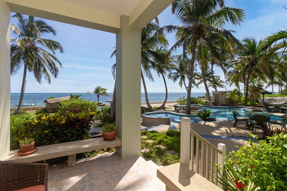 Large patio with ocean, beach and pool views
