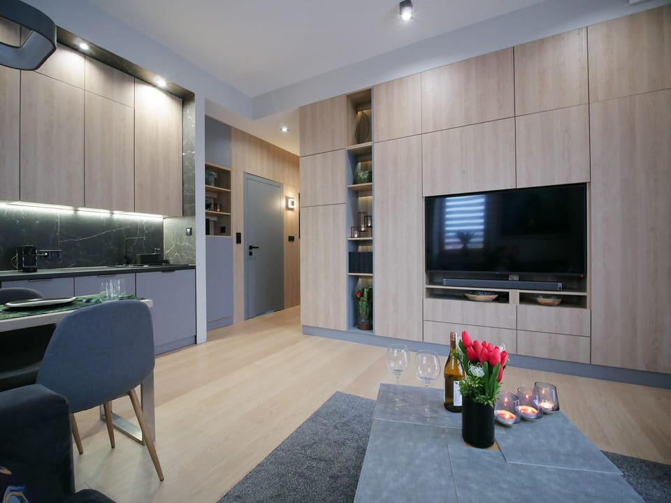 Comfort Apartment, Non Smoking, City View | Living area | 55-inch LED TV with satellite channels, TV, smart speakers