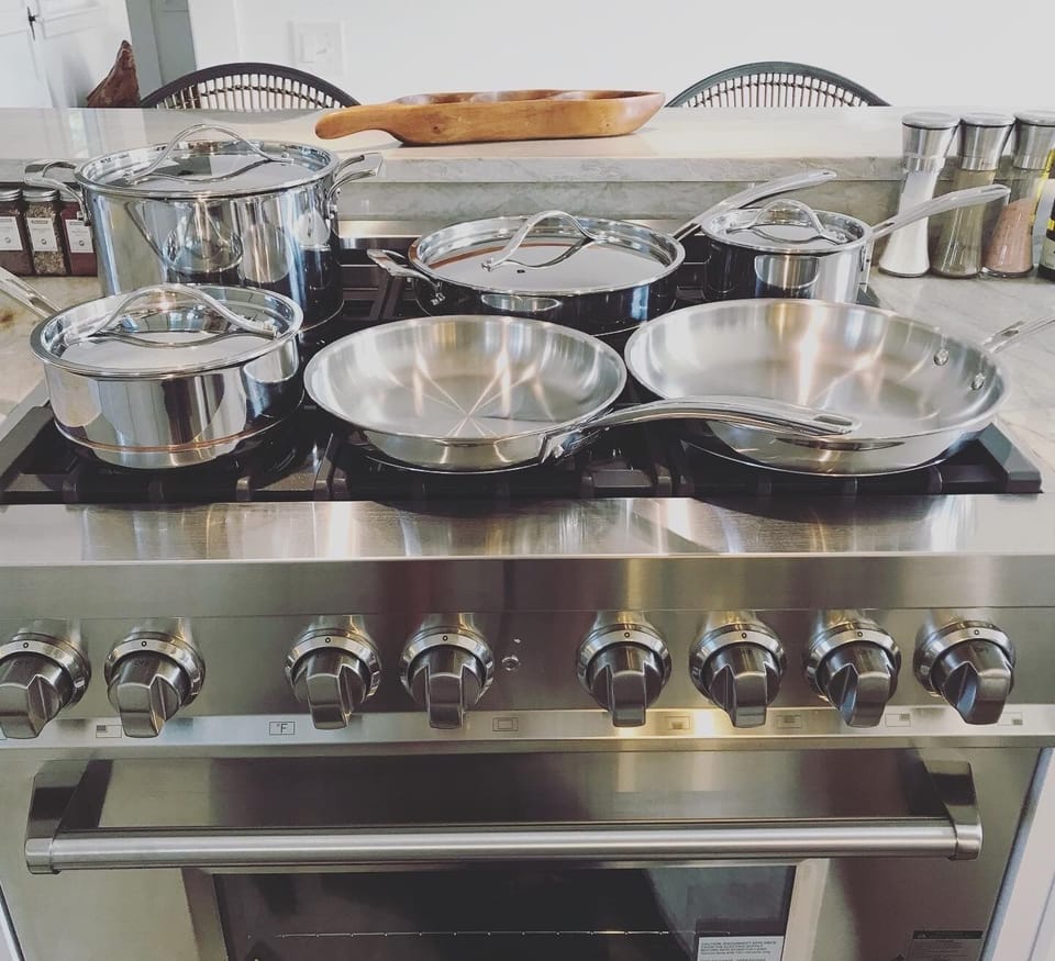Fully-equipped, kitchen has a cook-your-heart-out 36'’ range stove and hood. 