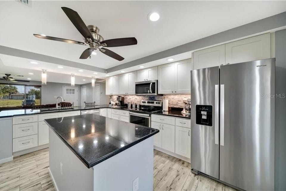 Kitchen with island & fridge