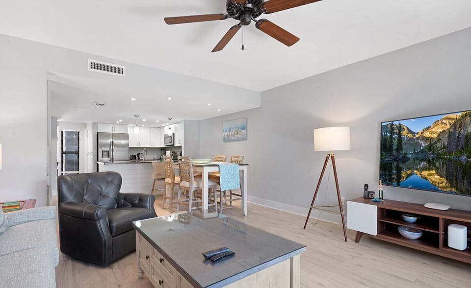 Living area looking to kitchen/dining