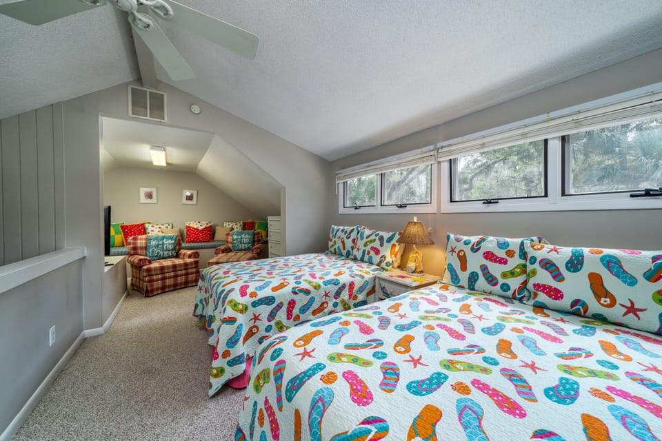 The loft is open to the great room and has 2 Full beds